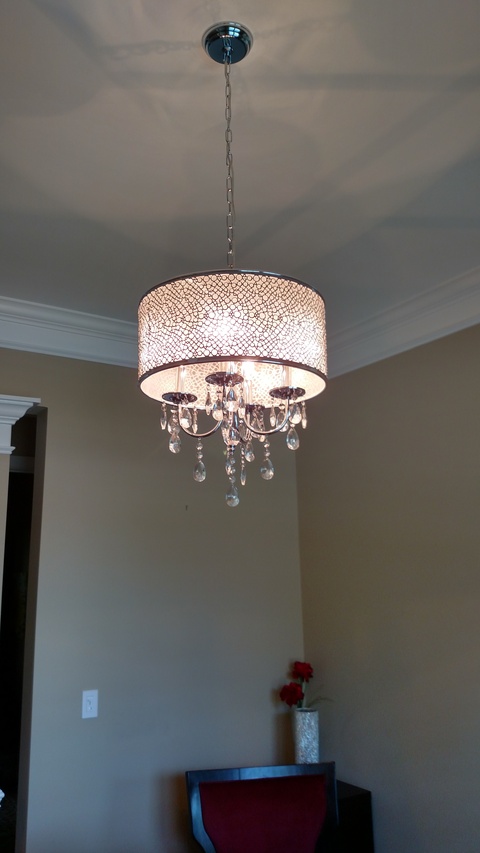 Contemporary Dining Room with crystal light fixture