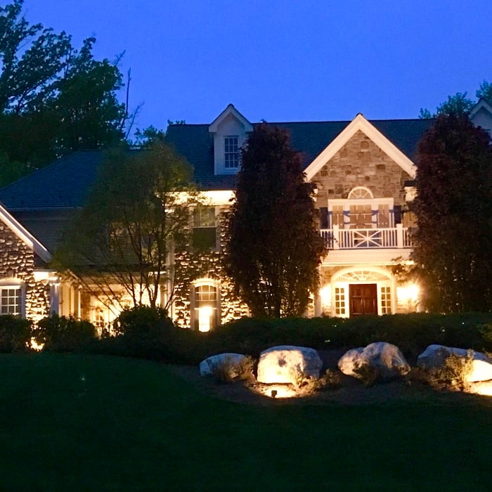 Grazing effect with tree up lighting & stone w
