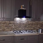 kitchen wall tile, cabinets work, and vent hood
