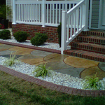Walkway, custom curbing, rock plant beds