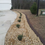 Driveway, rockbeds, custom curbing