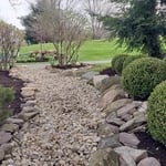 built stone pathway, trimmed, & mulched