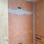 Installing new shower stall.