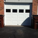 Clean white single car garage door