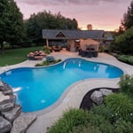 Freeform shaped pool with waterfalls in Parkton!