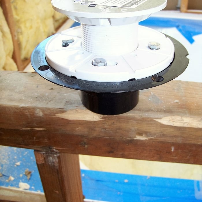 Installed adjustable drain