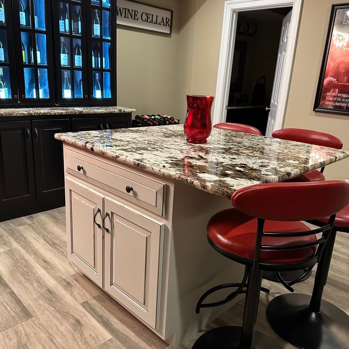 Island with contrasting cabinet and new granite