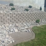 Retaining wall Bushes Rocks Curbing Sod