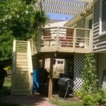 Deck resurface with horizontal railings.