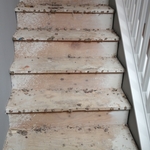 carpeted stairs to new wood staircase