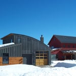 Foreground shop, background house