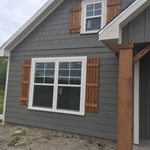 shake and lap siding, board and batten shutters and double hung windows