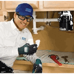 Fixing a clogged drain.