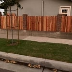 Dogeared Redwood Fence between Brick Pilasters