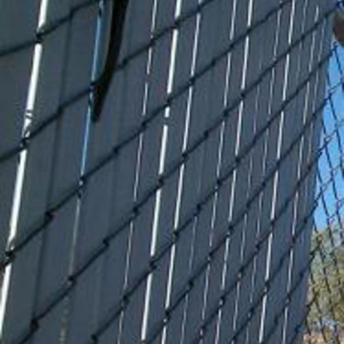 repaired chain link fences and installed new slat