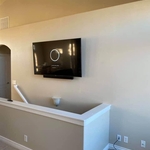 Tv above stairs, cables hidden
