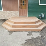 New porch with walk ways and rock beds