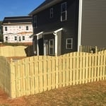 Shadowbox fence cut arch with french gothic posts
