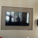 Wall mounted TV with surround sound