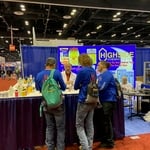Boys learning at the Leak Lock booth