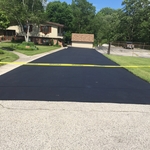 Asphalt sealcoating