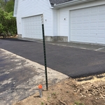 Four bay garage, asphalt driveway and concrete garage apron