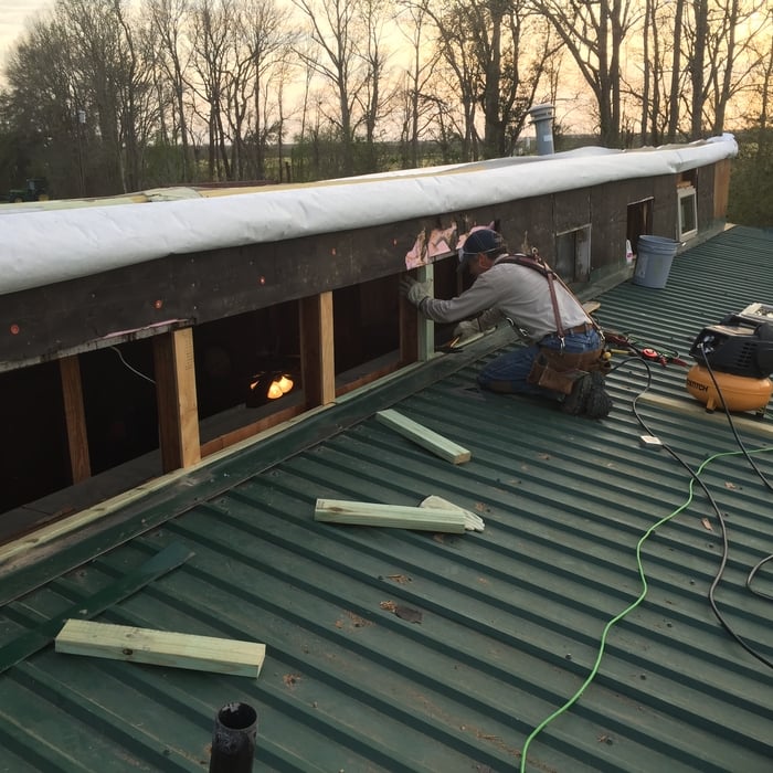 Parapet wall repair and framing for new windows