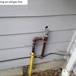 Disconnecting an old gas line.