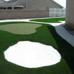 Backyard putting green.