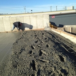 IN THE PROCESS OF POURING A SLAB