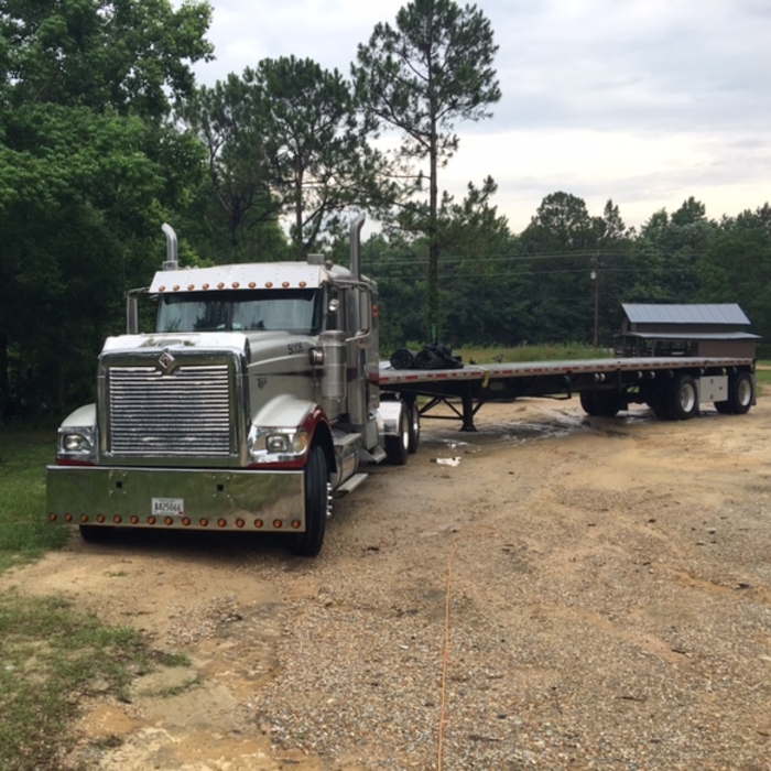 Pressure washing of Exterior 18 Wheeler and flat b
