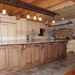 Old World Country Charm for a Spacious Kitchen With Stone Cooking Station