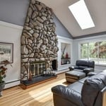 Faux cobble rock fireplace, skylights, 4 lite sliding glass window and light wood floor