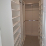 Walk in closet with shoe shelves