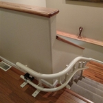 Curved stair lift with 90 degree park at top