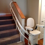 Curved stair lift with 90 degree park at bottom