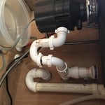 Leaking disposal with improper drain. (BEFORE)