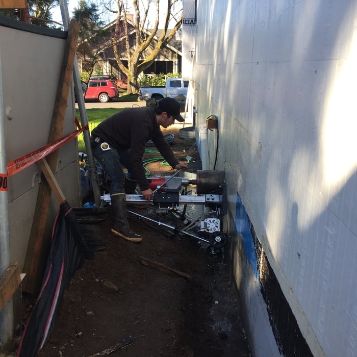 Wall mounted concrete drill