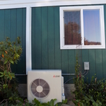 Outdoor unit with white sheet metal lineset cover