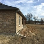 Gutter with flex downspout extensions