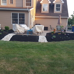 mulched the flower bed and around the river rocks