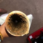 A section of a broken badly scaled pipe