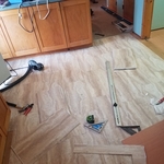 Putting in the new laminated flooring.