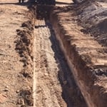 Digging Trenches for Disposal Field