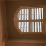 Arched bathroom shutter