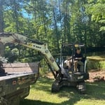 Removing silt from pond