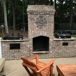 Outdoor brick grill with gireplace