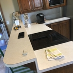 Before picture of cooktop and raised bar