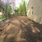 Behind garage