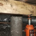 Jack under pier and beam home
